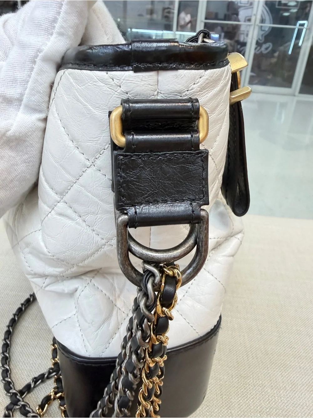 CHANEL White and Black Quilted Leather Hobo Bag with Gold CC Charm